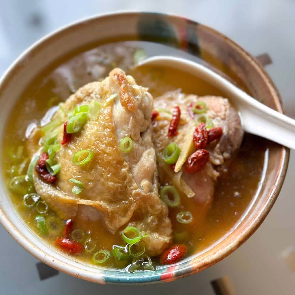 Sesame oil chicken postpartum recipe served warm, a classic confinement dish with ginger and rice wine